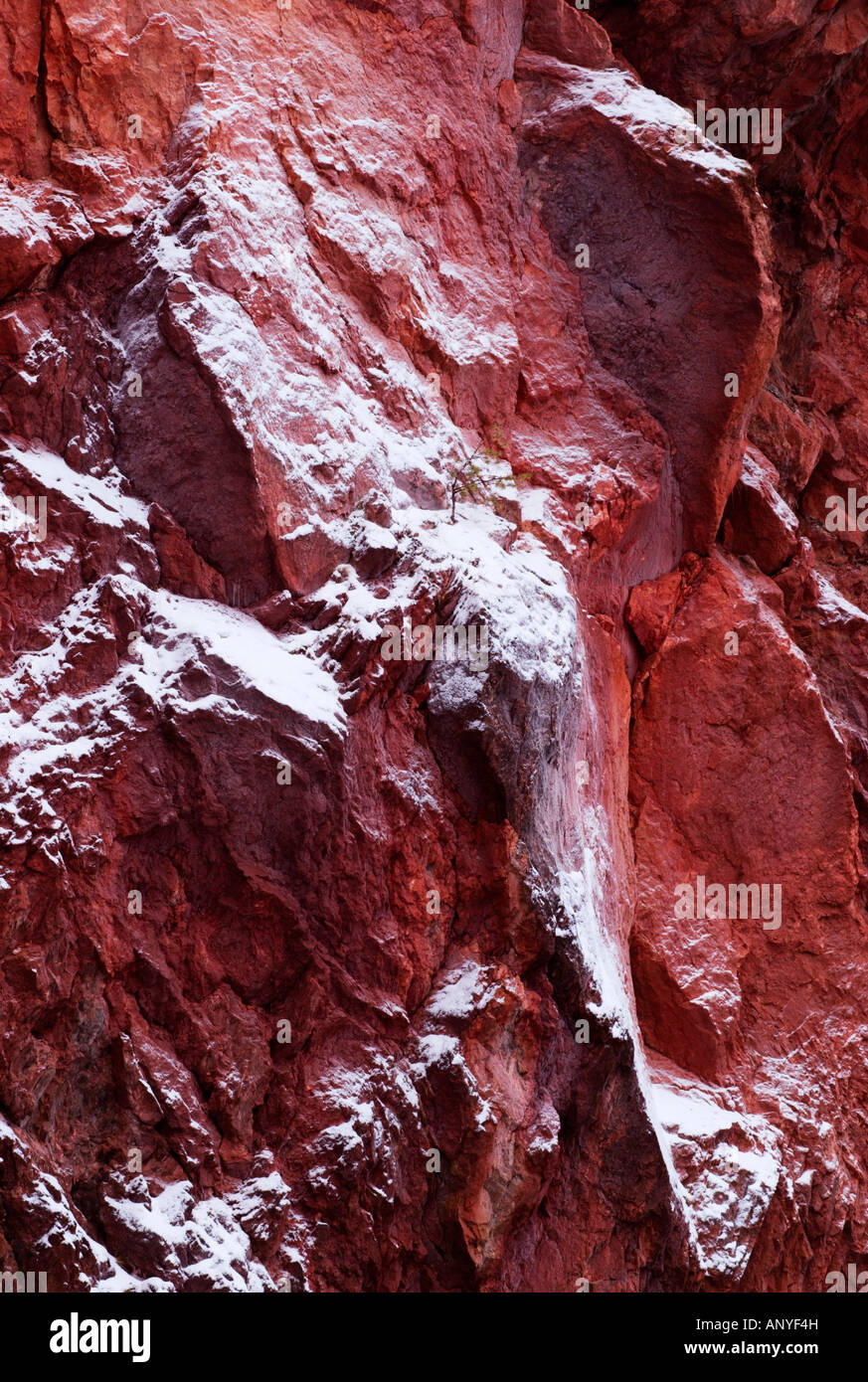 Red limestone rock wall with fresh snow cover in Oulanka National park, Kuusamo, Finland Stock
