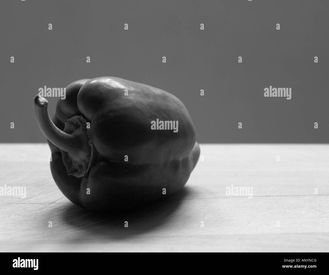 Bell pepper on chopping board in monochrome Stock Photo - Alamy