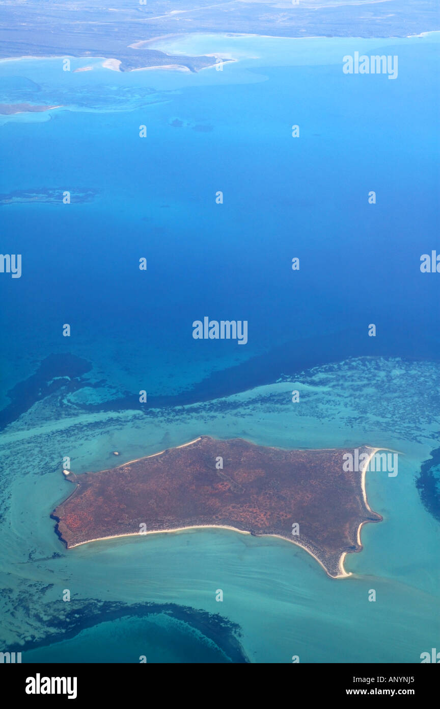 Shark Bay Marine Park and World Heritage Area aerial view of bays and islands showing seagrass beds and arid red landscape Stock Photo
