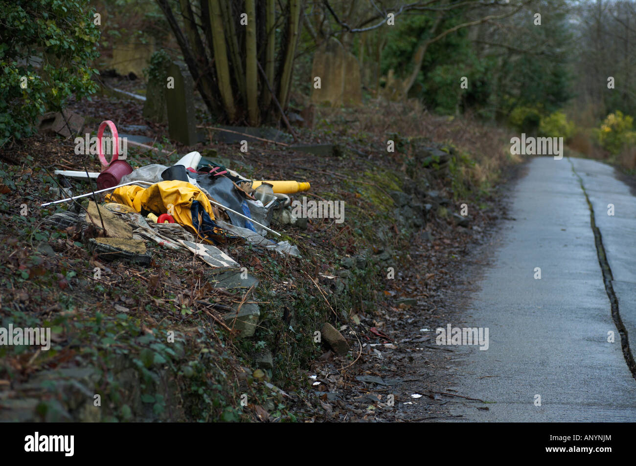 Fly tipping at Arnos Vale Cemetery Bristol England Stock Photo