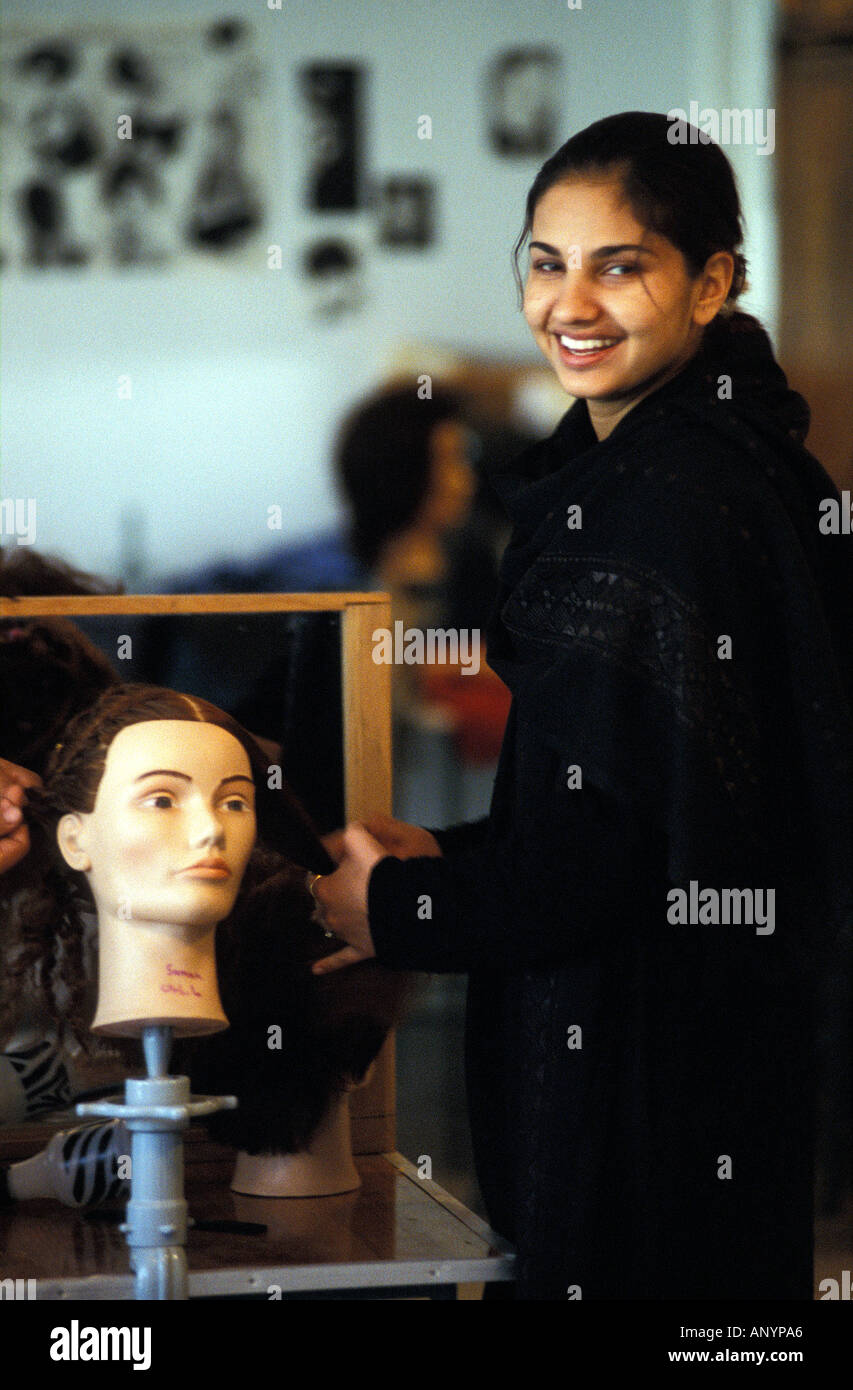 Kabul Palwasha practising a hairdo on a mannequin in the first Beauty School of Afghanistan