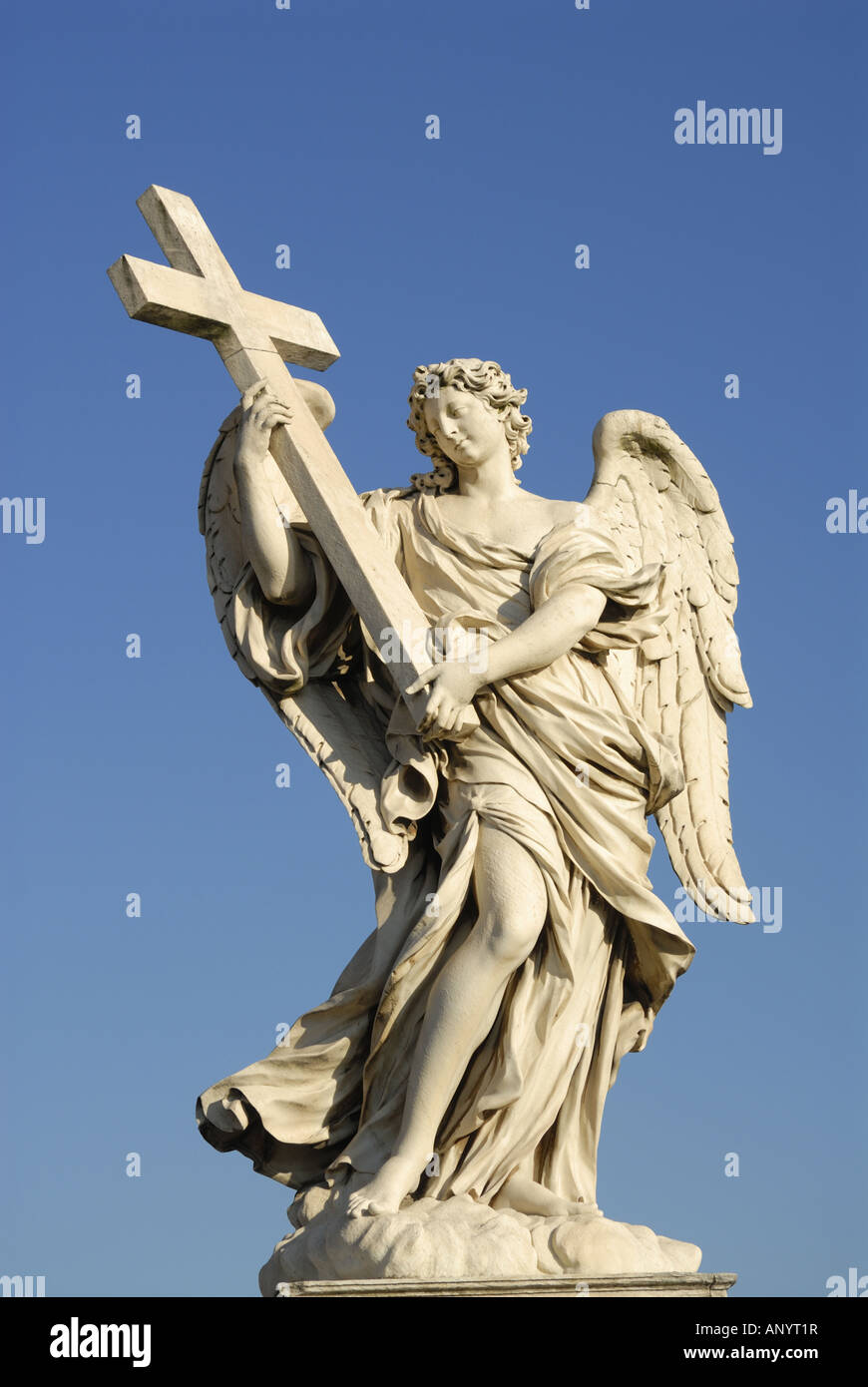 vertical view statue of Angel carrying cross near Castel Sant Angelo