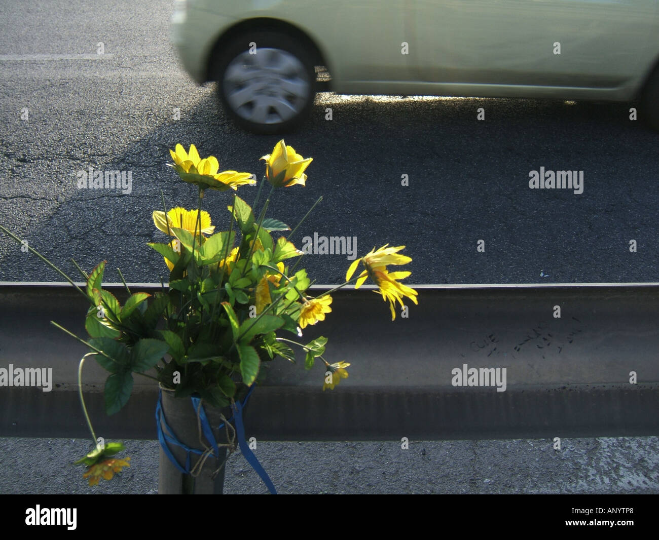 bunch of flowers left at fatal car crash scene Stock Photo Alamy
