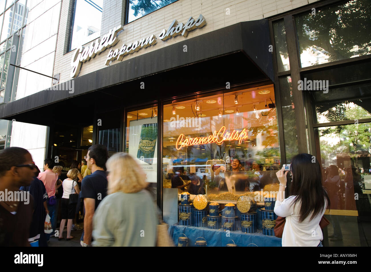 ILLINOIS Chicago Garrett popcorn store window on Michigan Avenue people