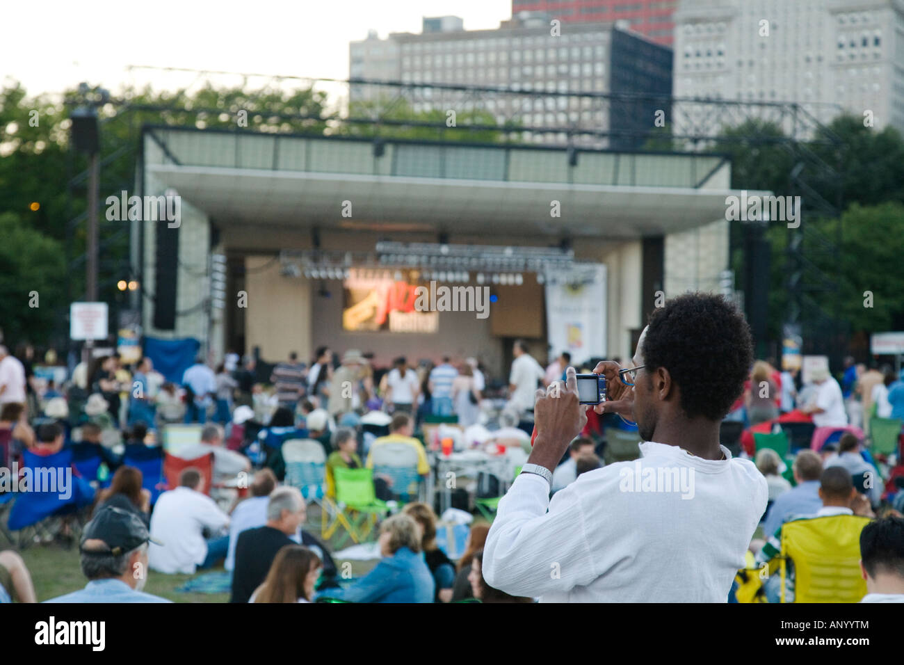 ILLINOIS Chicago Crowd of people sitting in Grant Park Petrillo outdoor