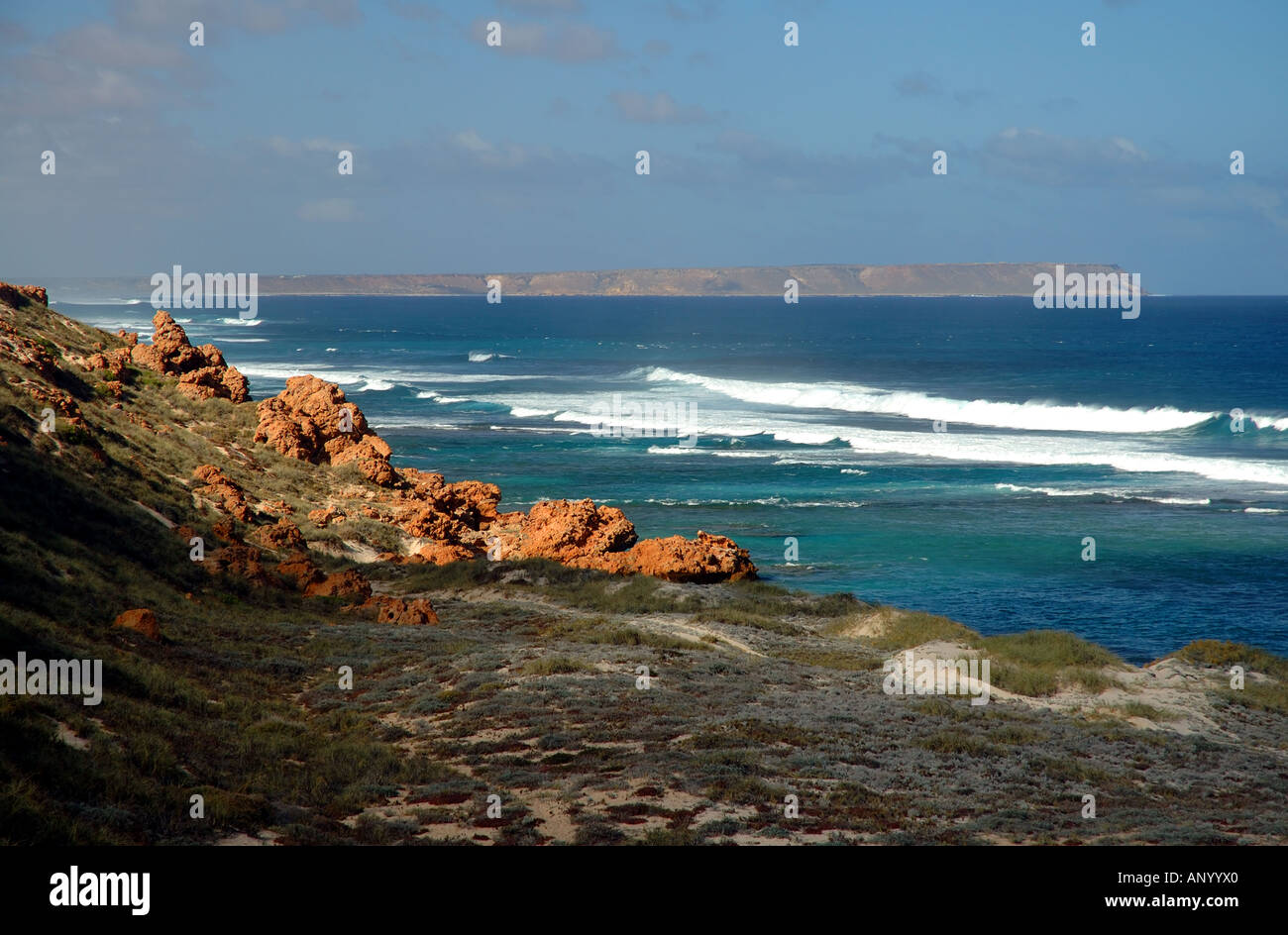 Rough coastline of southern Ningaloo Reef Marine Park with its southern boundary Red Bluff on the horizon Western Australia Stock Photo