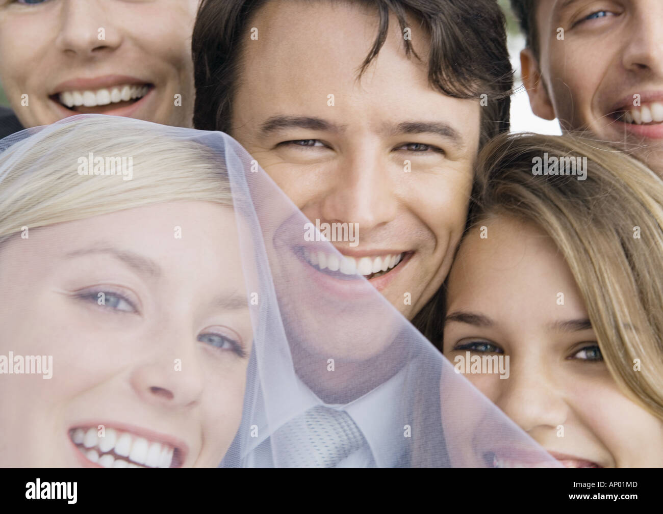 Bride and groom with friends, close-up of faces Stock Photo