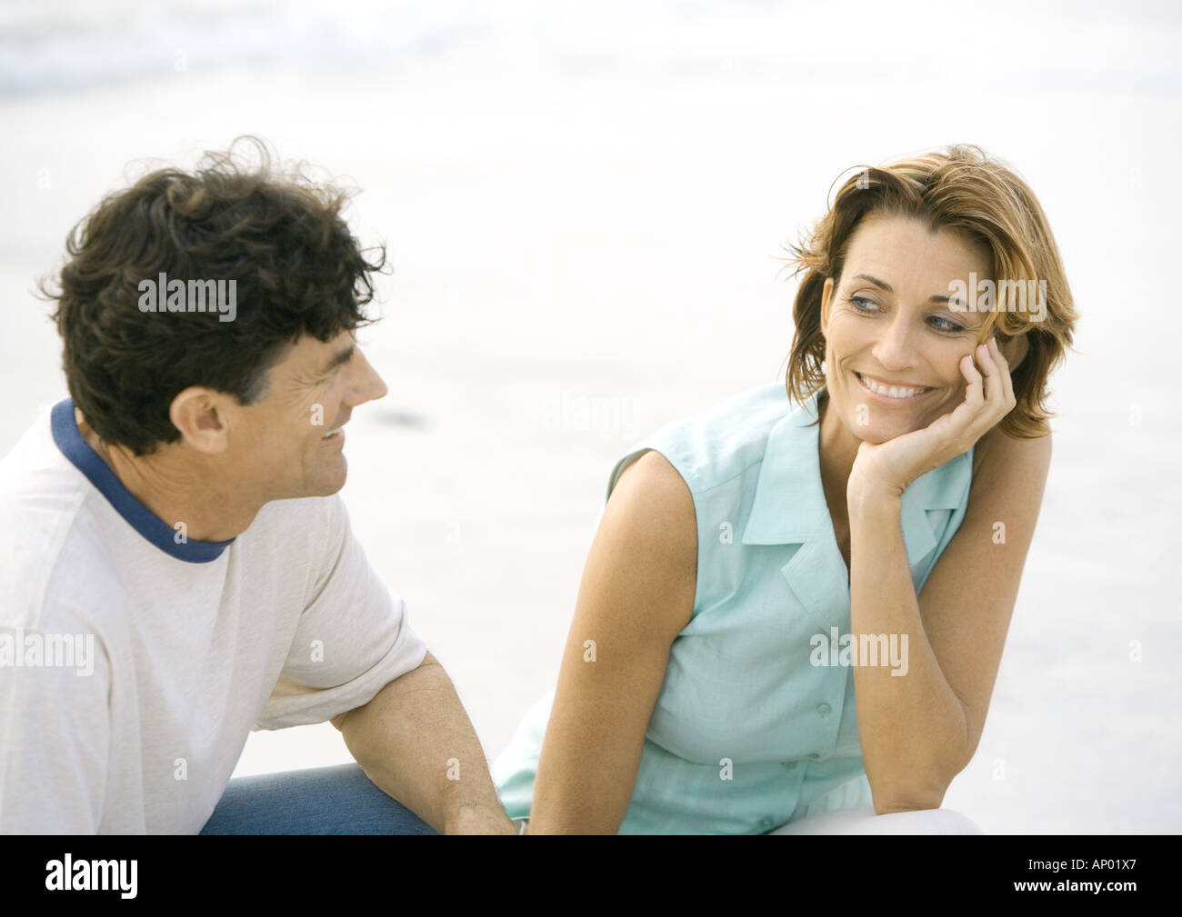 Mature couple smiling at each other Stock Photo
