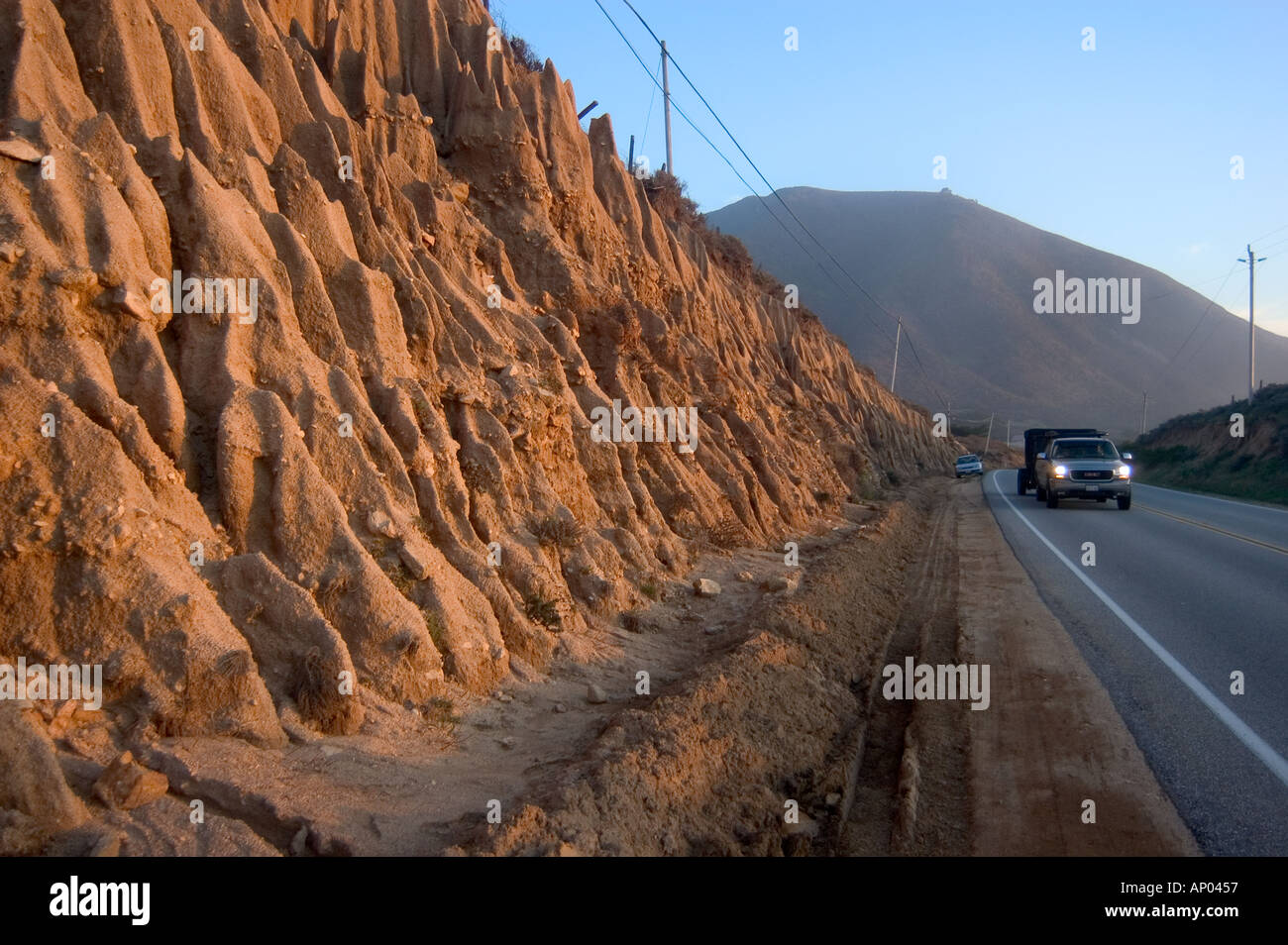 SOIL EROSION creates beautiful fluted shapes and is caused by a roadway
