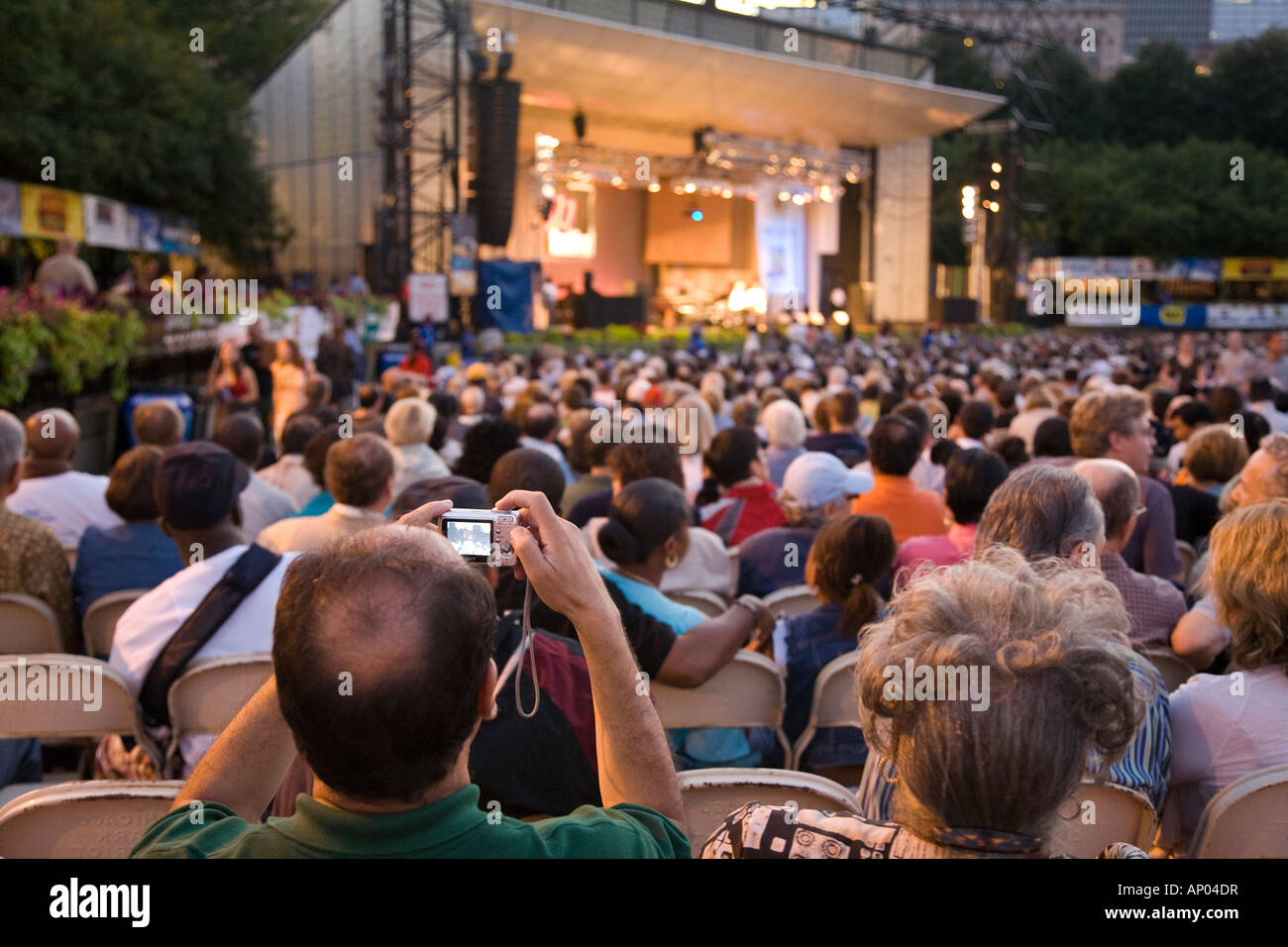 ILLINOIS Chicago Crowd of people sitting in Grant Park Petrillo outdoor