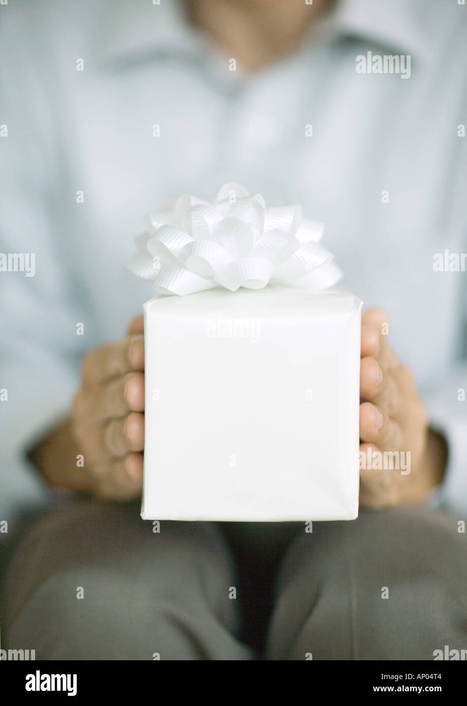Man Raging Out Gift Man holding wrapped gift hi-res stock photography and images - Alamy