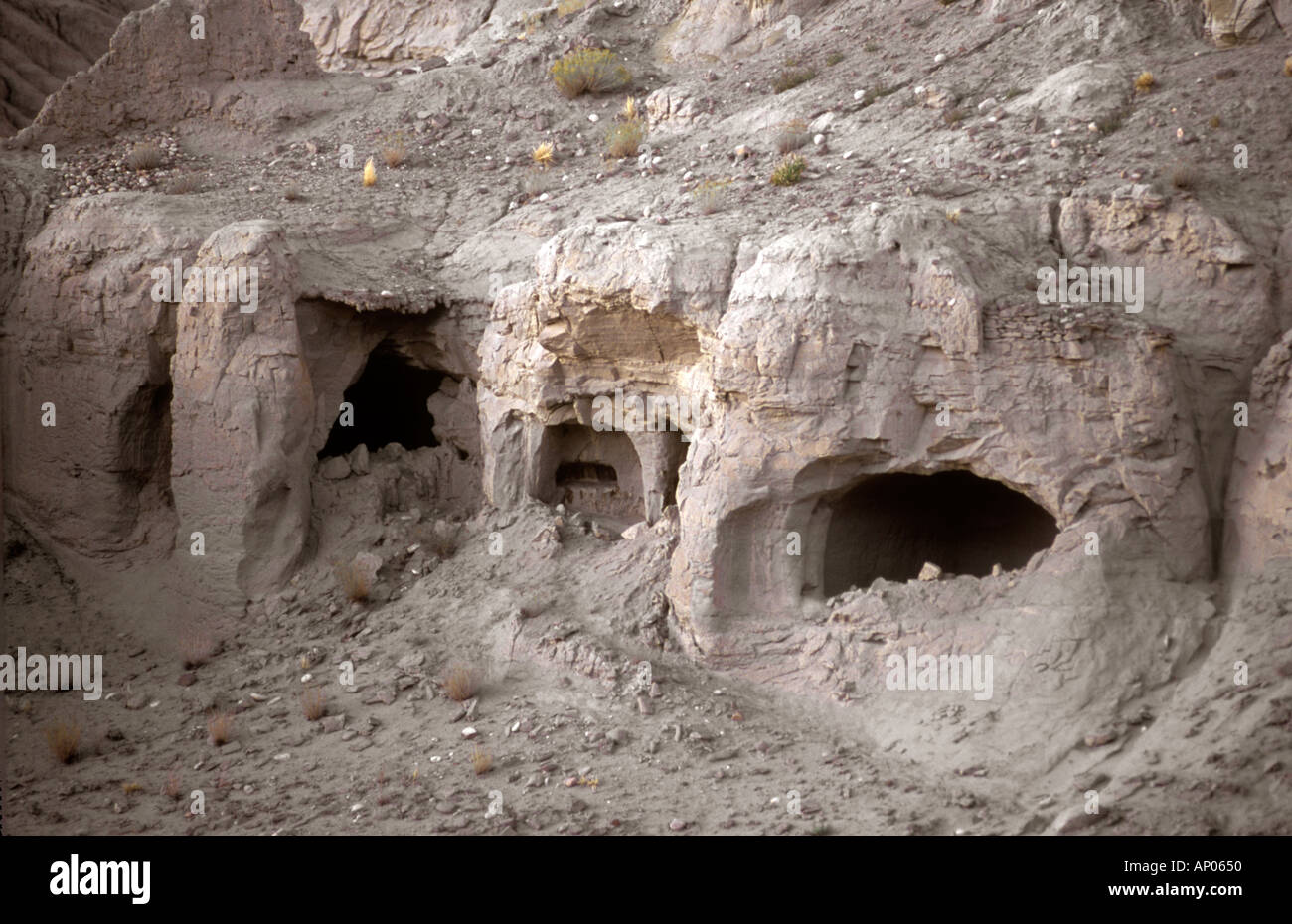 CAVE DWELLINGS near THOLING date back to the 10th Century in the GUGE KINGDOM west of MOUNT KAILASH TIBET Stock Photo