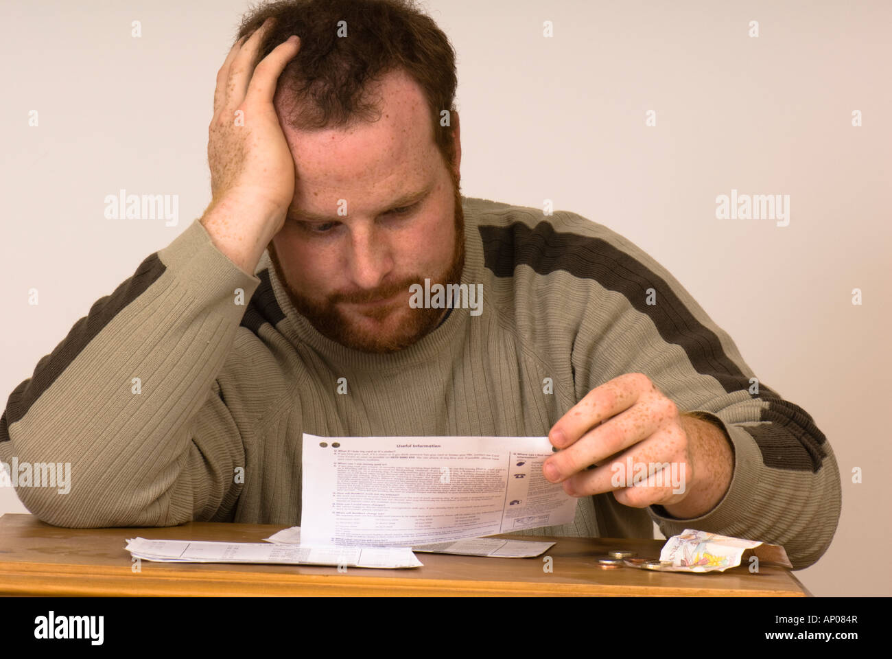 man looking at bank statements, money worries and finance Stock Photo
