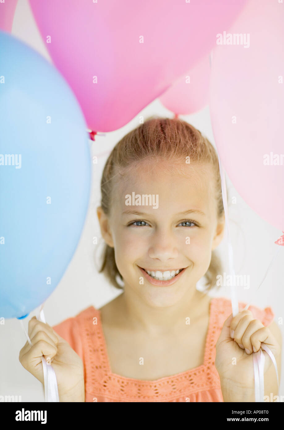 Girl holding balloons Stock Photo Alamy