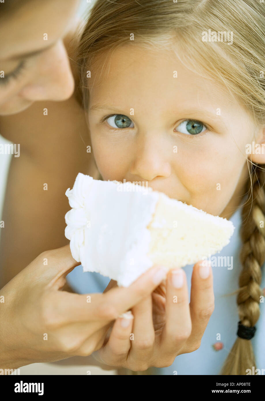 Girl eating cake Stock Photo Alamy