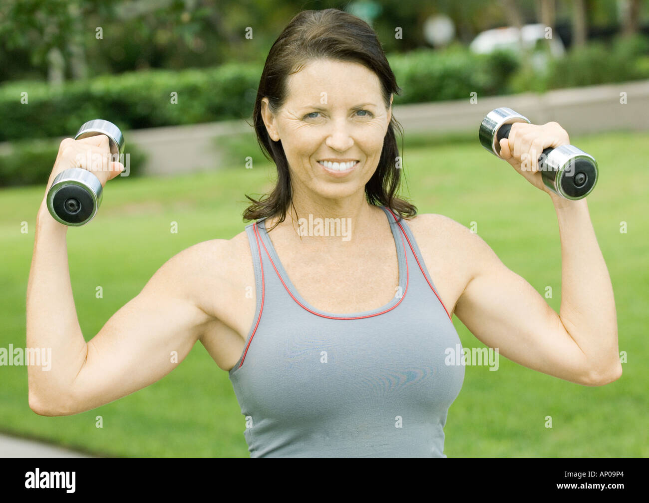 Smiling mature woman outdoors hi-res stock photography and images - Alamy