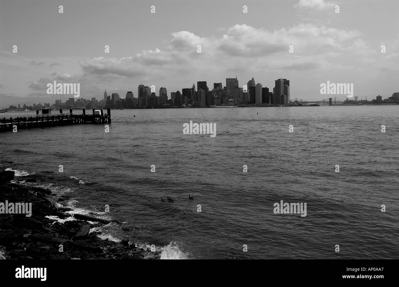 black white view of lower manhattan south side from liberty island new york city USA Stock Photo