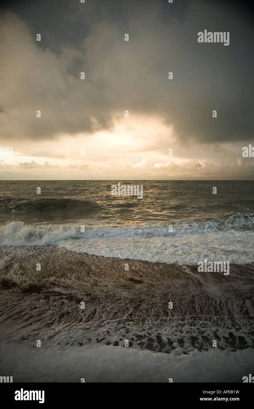 Stormy sky at dusk over a glistening sea Stock Photo - Alamy