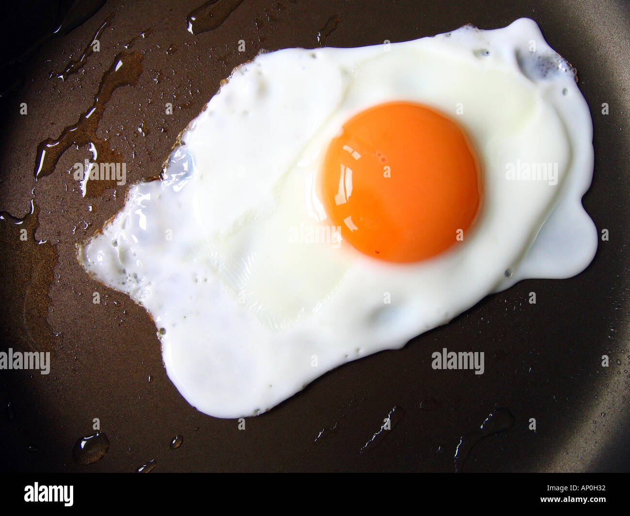 tight shot of pan fried egg Stock Photo