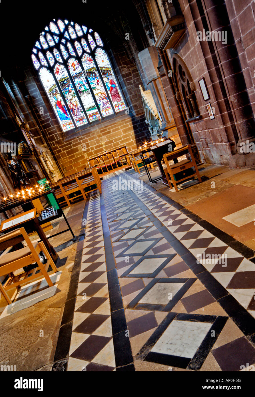 Tiled floor and stained glass window in Chester Cathedral Stock Photo