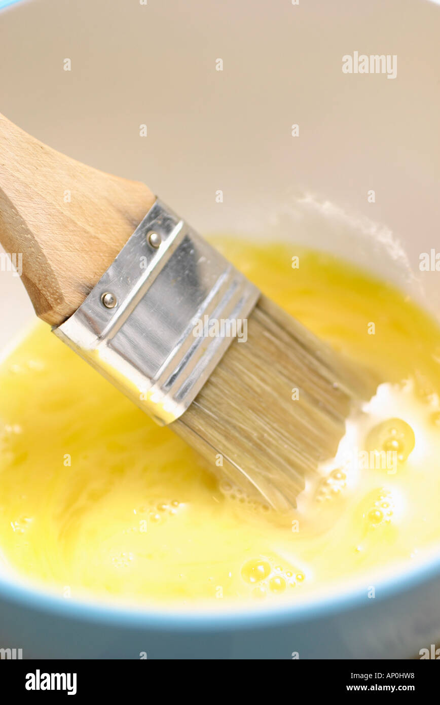 egg wash with brush Stock Photo Alamy