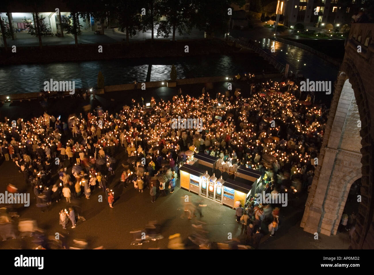 Pilgrims gathering for candlelight procession Lourdes France Stock