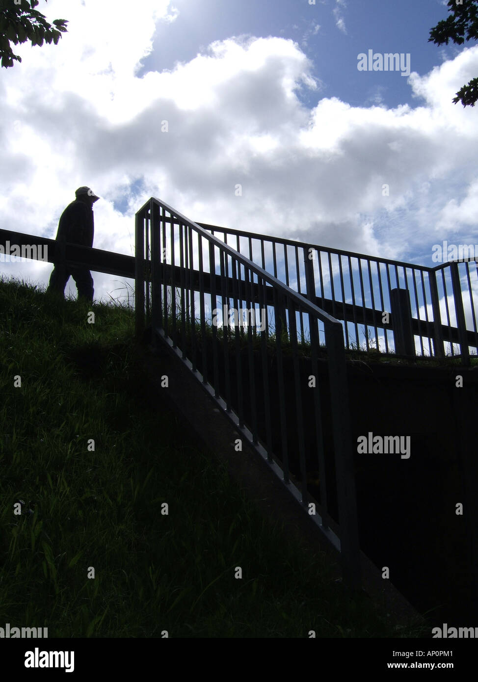 silhouette of man walking over bridge subway in country Stock Photo - Alamy