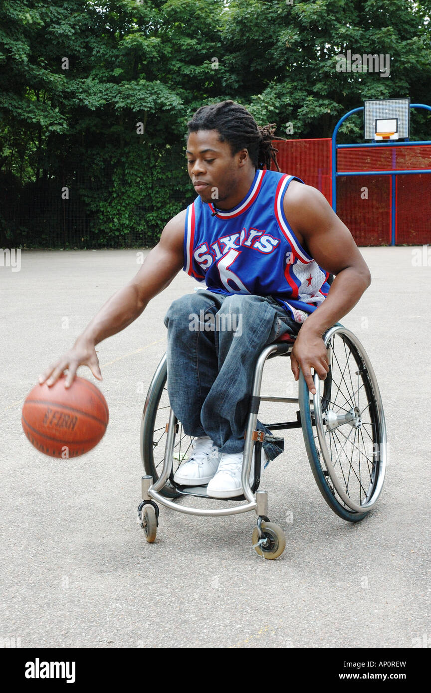 Ade Adiptan, disabled basketball player,bouncing a ball from hgis