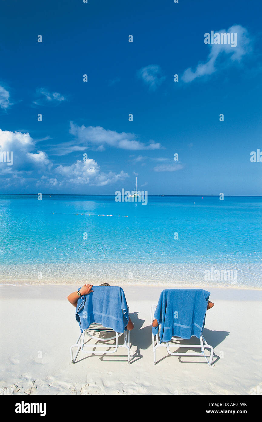 Deck chairs on Seven Mile Beach, Grand Cayman, Cayman Islands, Caribbean Stock Photo