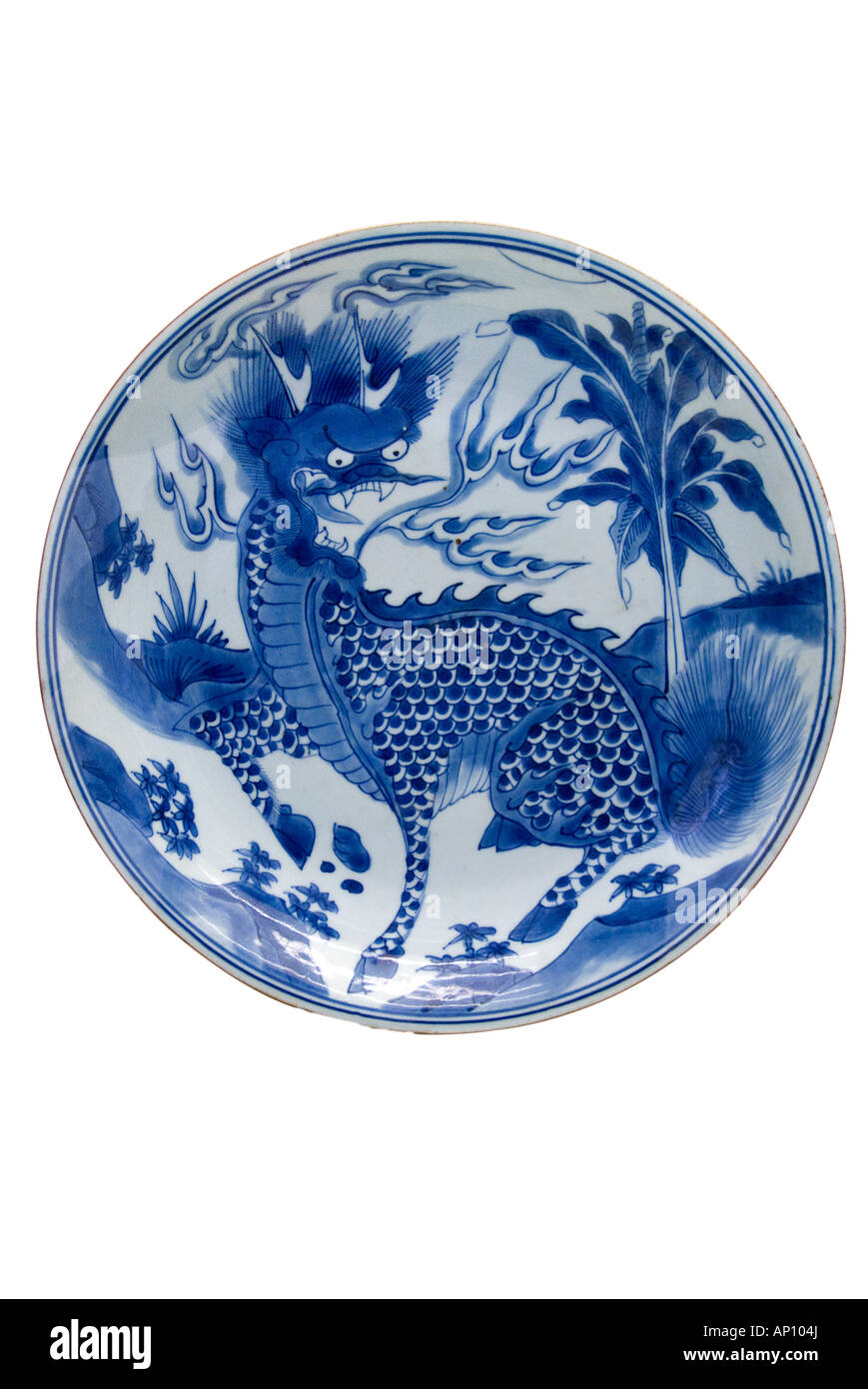 dragon plate Chinese mythical beast fierce scaled fire flame breath fang teeth blue floral design export porcelain family kiln g Stock Photo