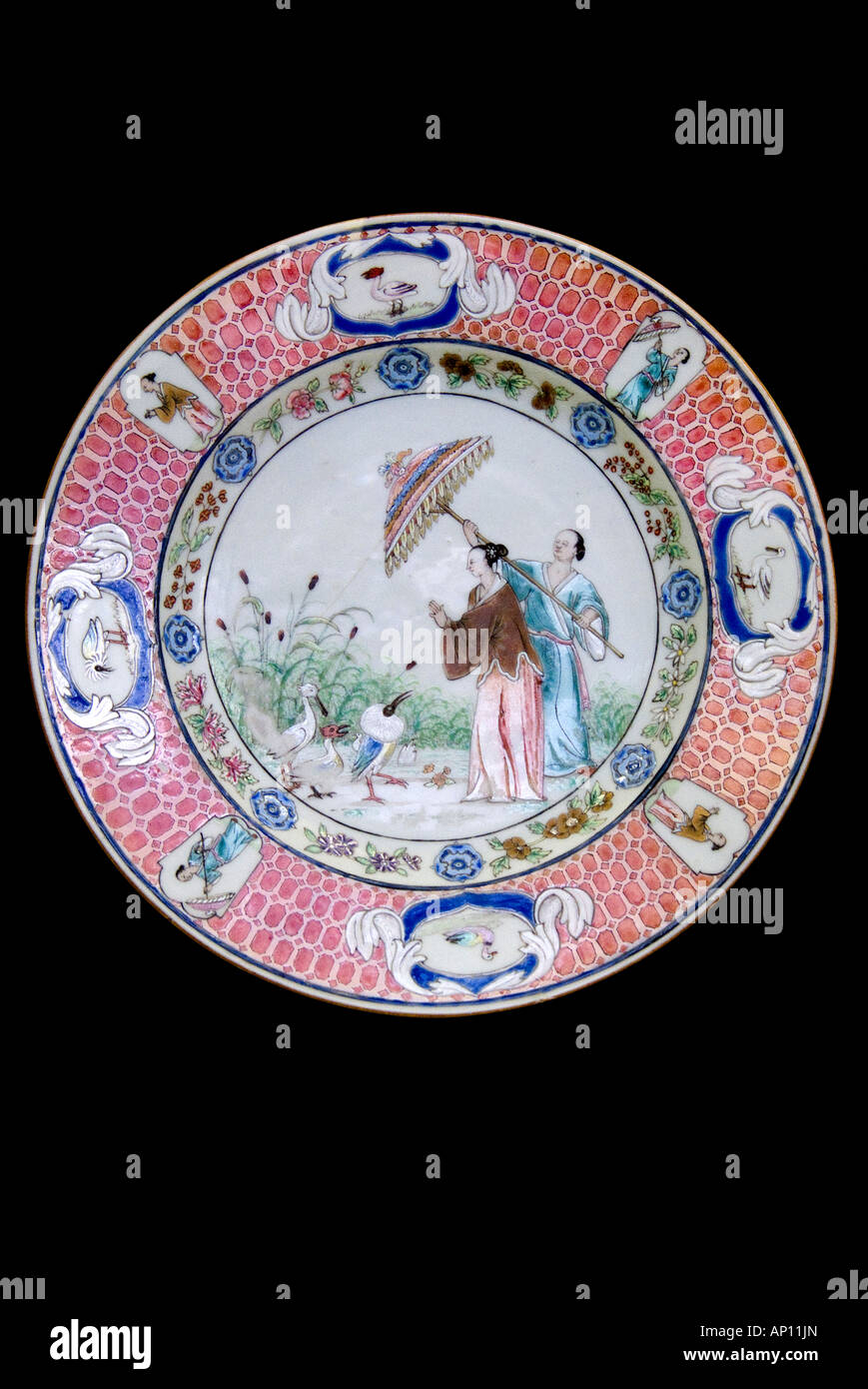 porcelain ceramic plate Chinese figurative parasol umberella pelican  flower garden Manchu Dynasty  Aisin Gioro northeast China Stock Photo