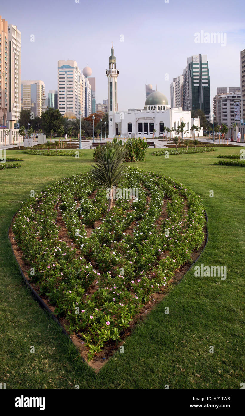 Gardens and mosque with modern buildings, Abu Dhabi, United Arab Emirates Stock Photo