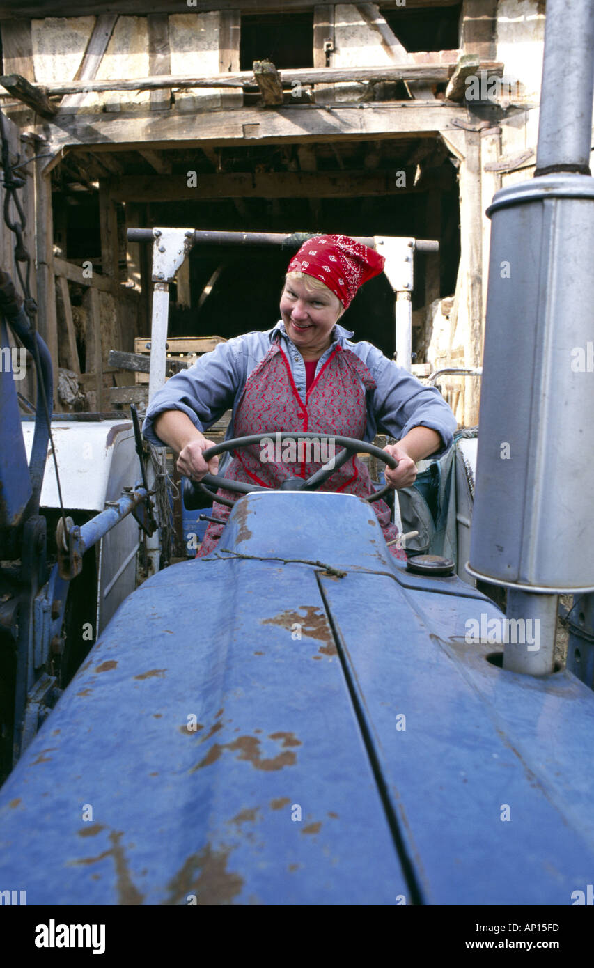 happy female farmer driving her tractor Stock Photo - Alamy