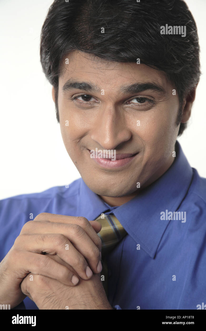 ANG200046 Executive looking into camera and smiling Model release No 687M Stock Photo