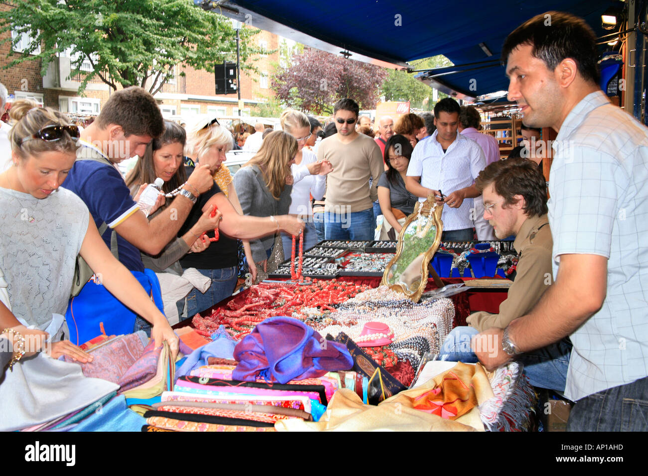 Buying Jewelry in the Portobello Road Market in London Stock Photo - Alamy