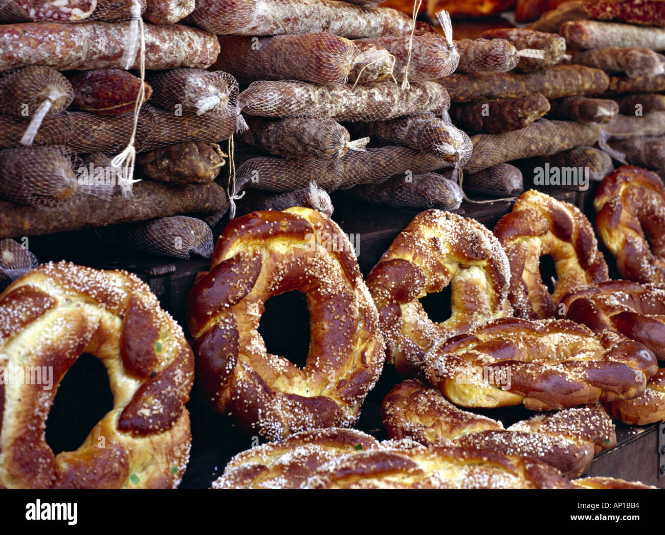 pile of country sausages and rows of circled bread Stock Photo - Alamy