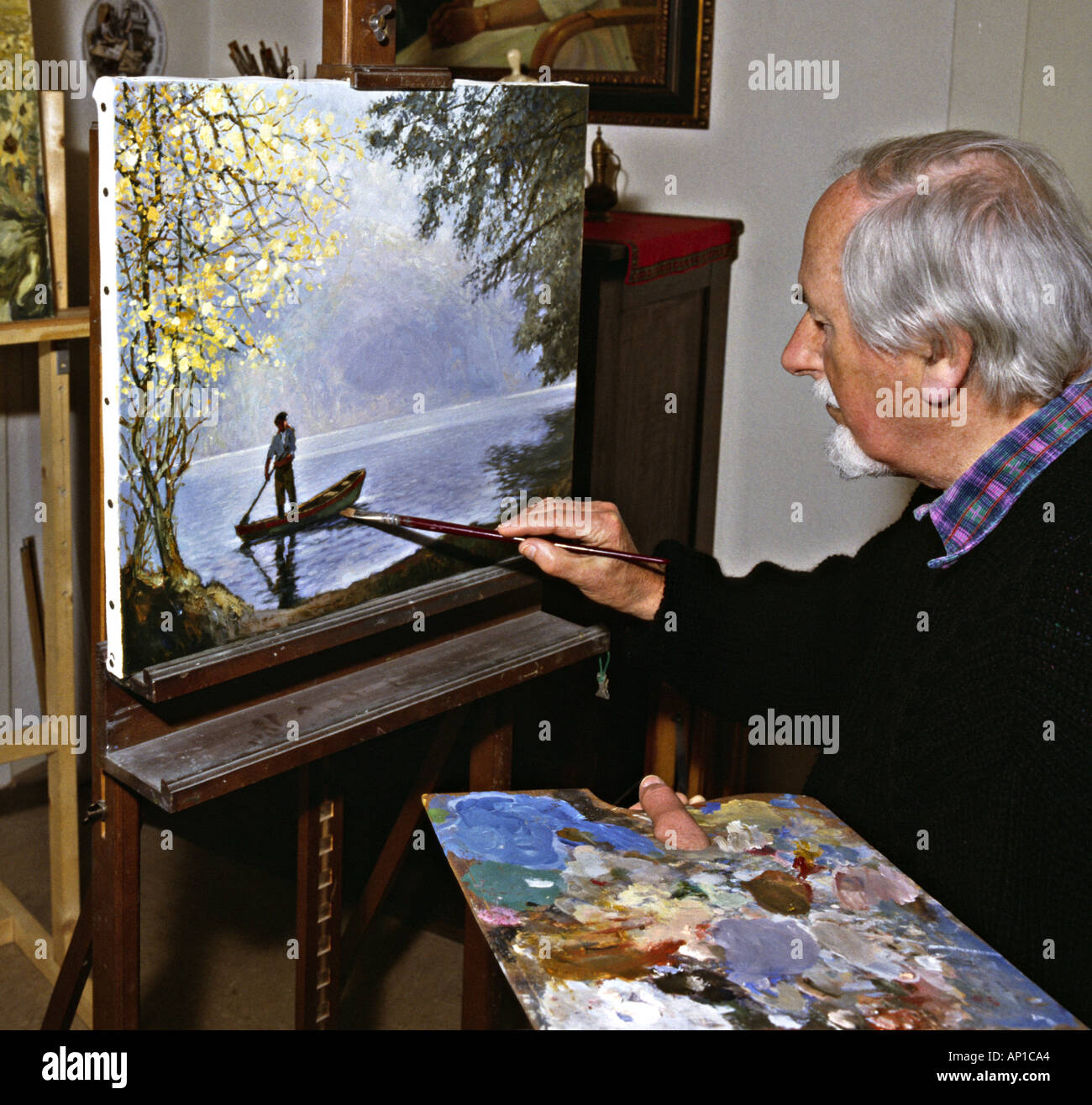 artist in his studio elder man making oil painting Stock Photo Alamy