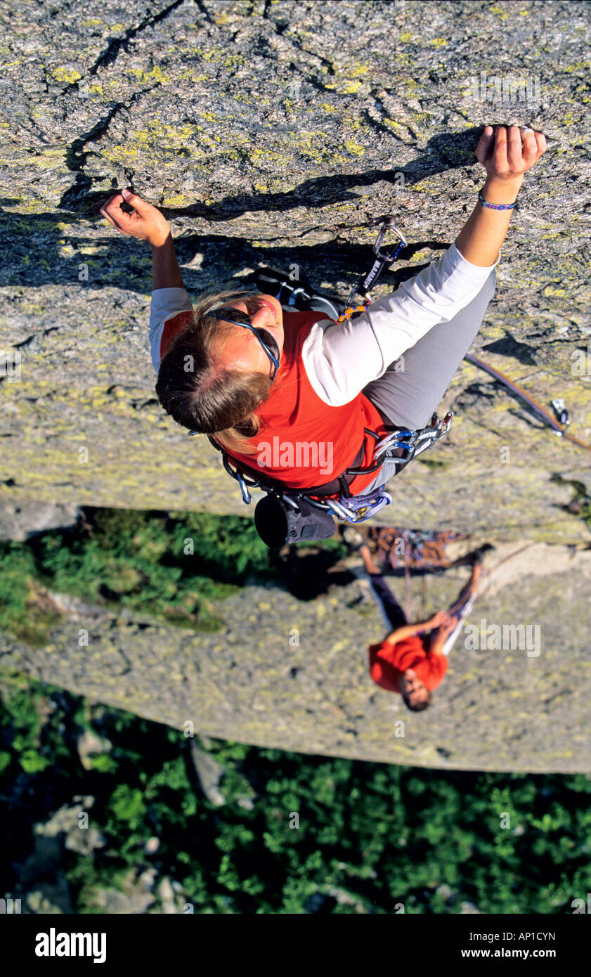 Young woman freeclimbing at rock, Bernese Oberland, Canton Uri, Switzerland, MR Stock Photo