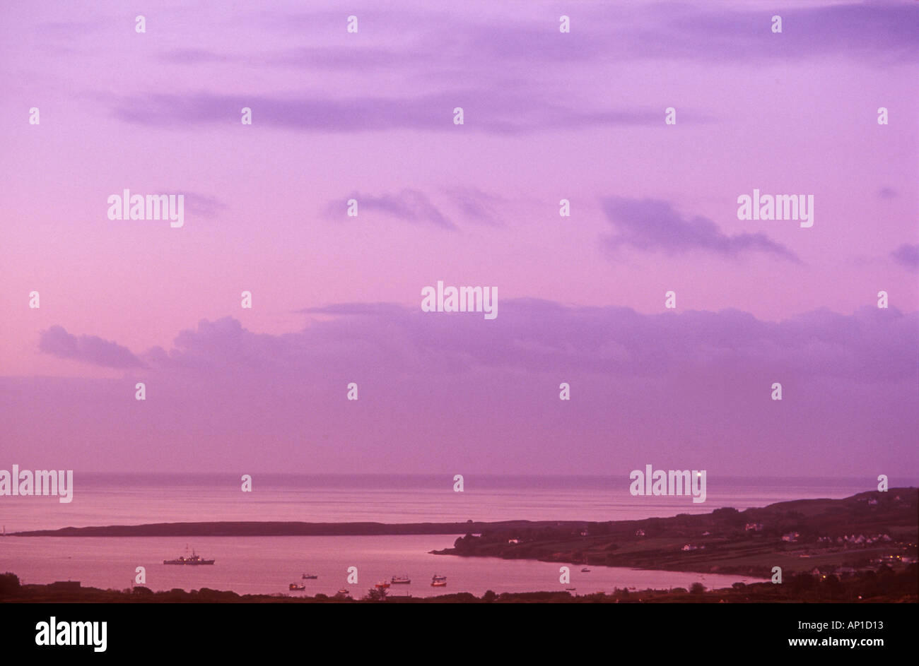 Dawn looking southwest from mount Gabriel to skull roaring water bay and fastnet rock lighthouse atlantic coast county cork Stock Photo