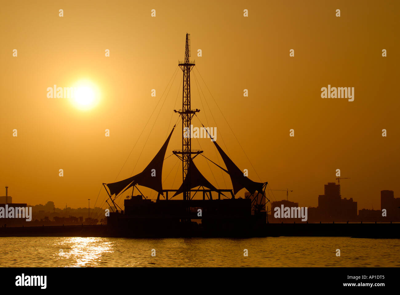 Silhouette of Marina Waves Building Arabian Gulf Kuwait Stock Photo