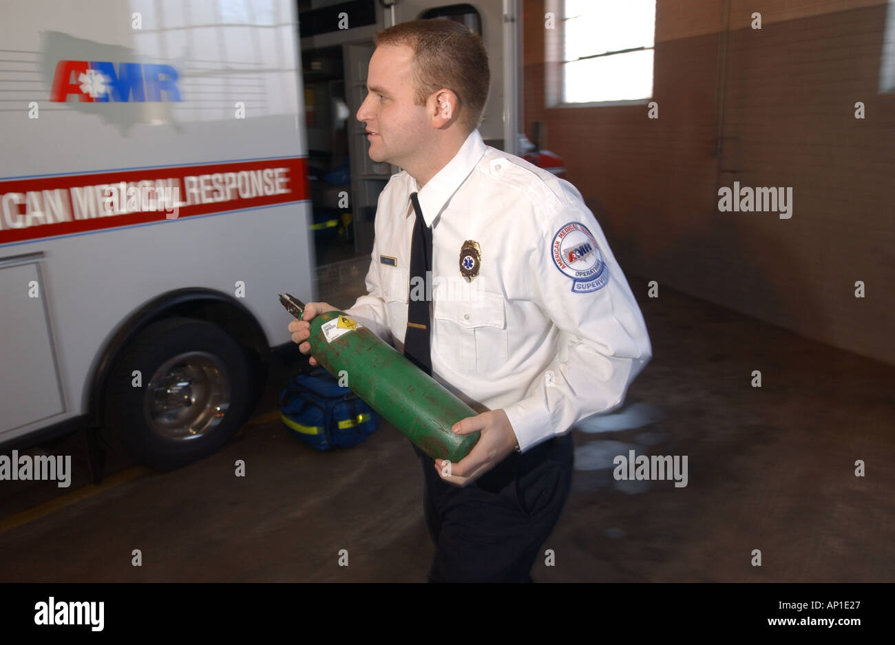 Medic Paramedic preparing equipment Oxygen tanks Stock Photo Alamy