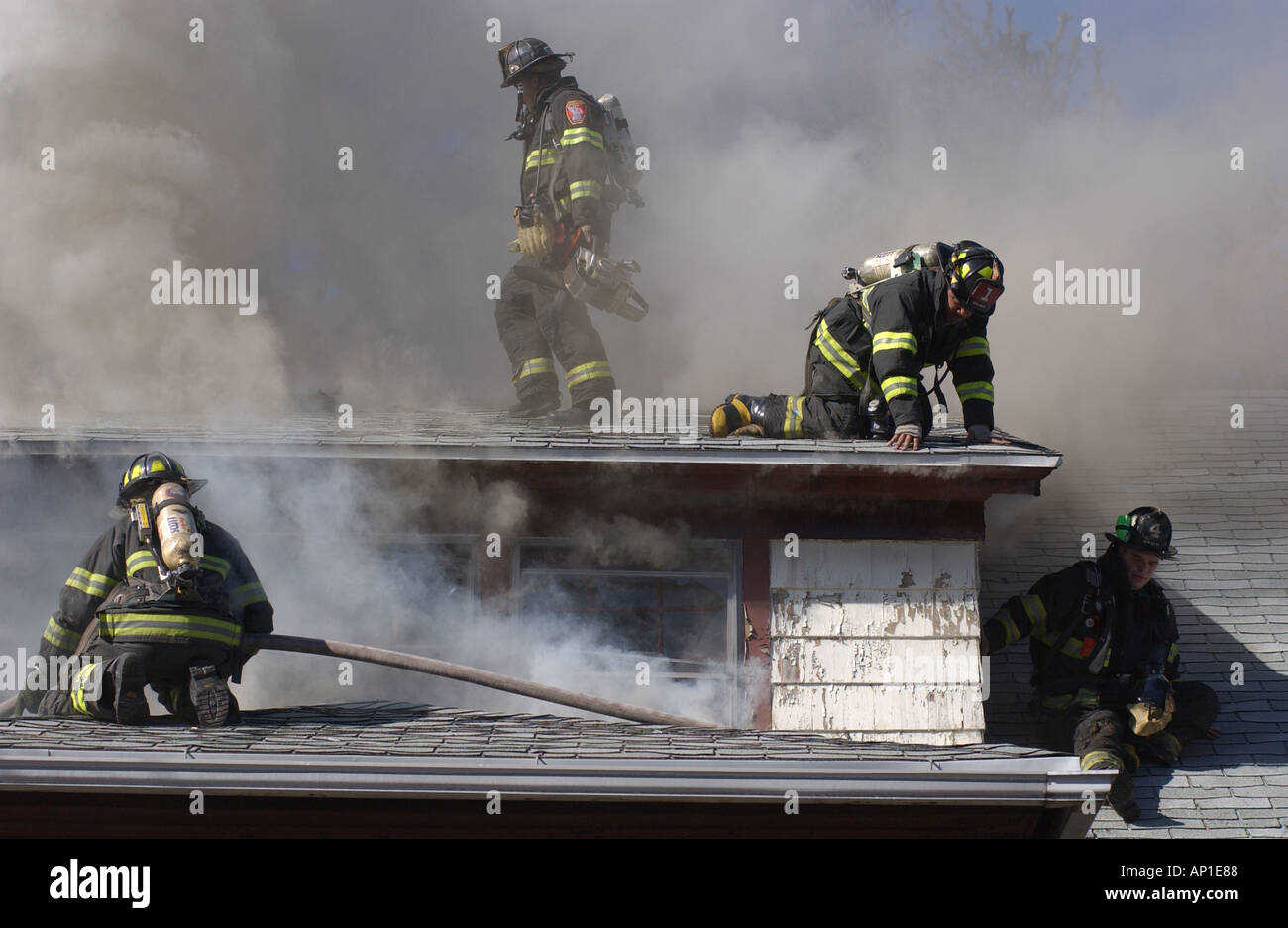Firefighters fighting a fire House fire in New Haven CT USA Stock Photo