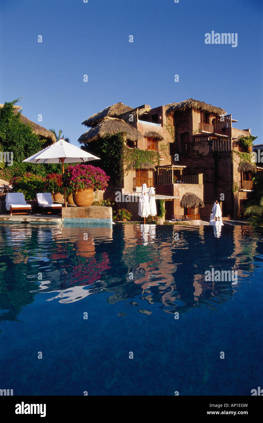 Small luxury hotel and reflection in Pool, La Casa que canta Zihuatanejo, Mexico, America Stock Photo