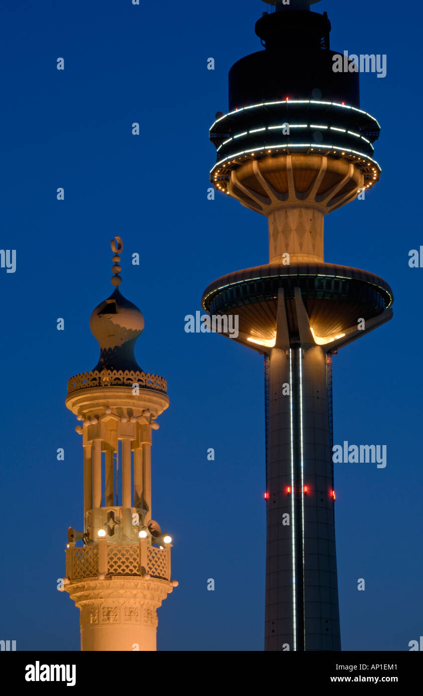 Liberation Tower and minaret at night Kuwait Stock Photo