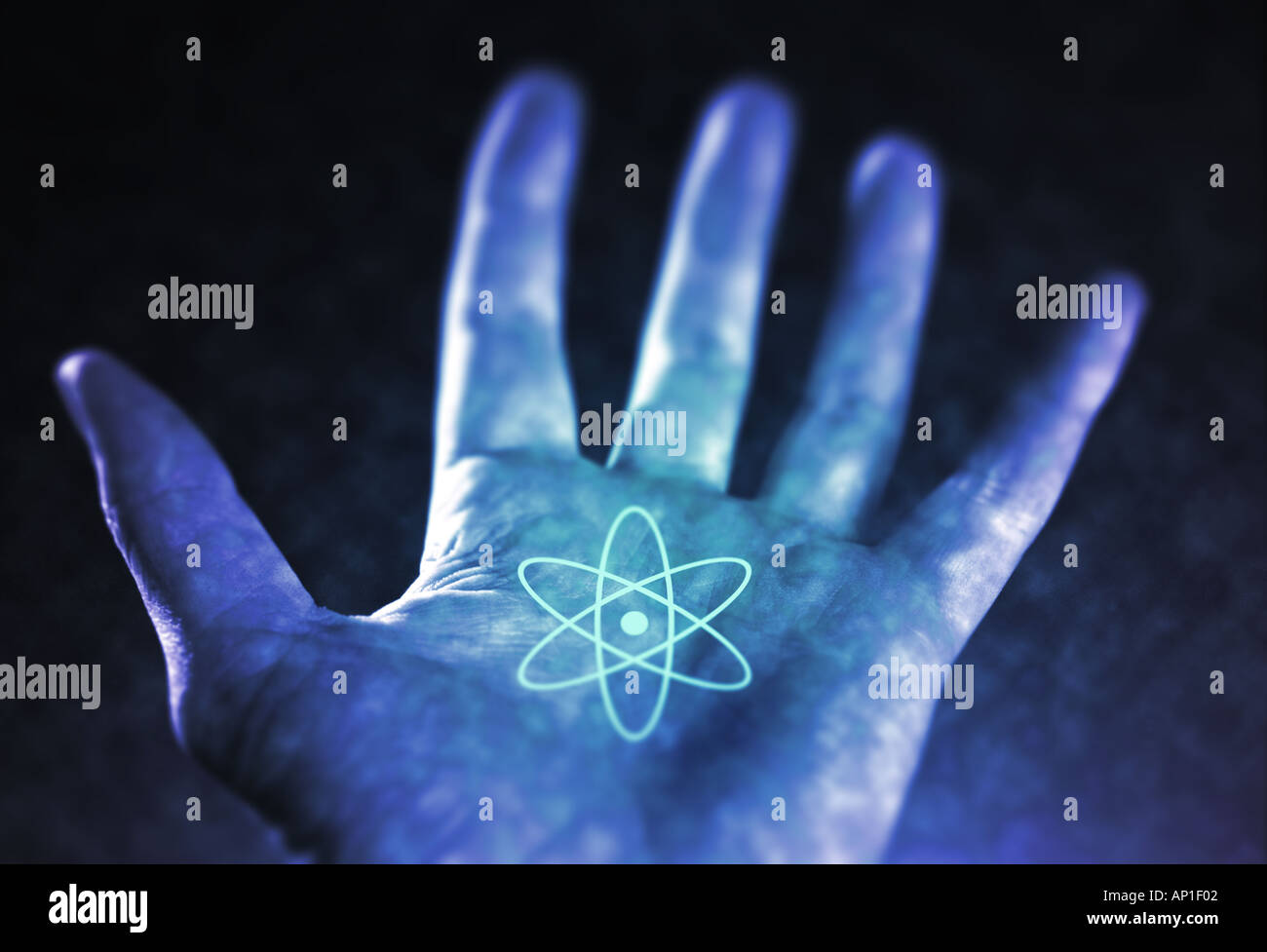 blue-hand-with-atomic-symbol-cool-concept-idea-stock-photo-alamy