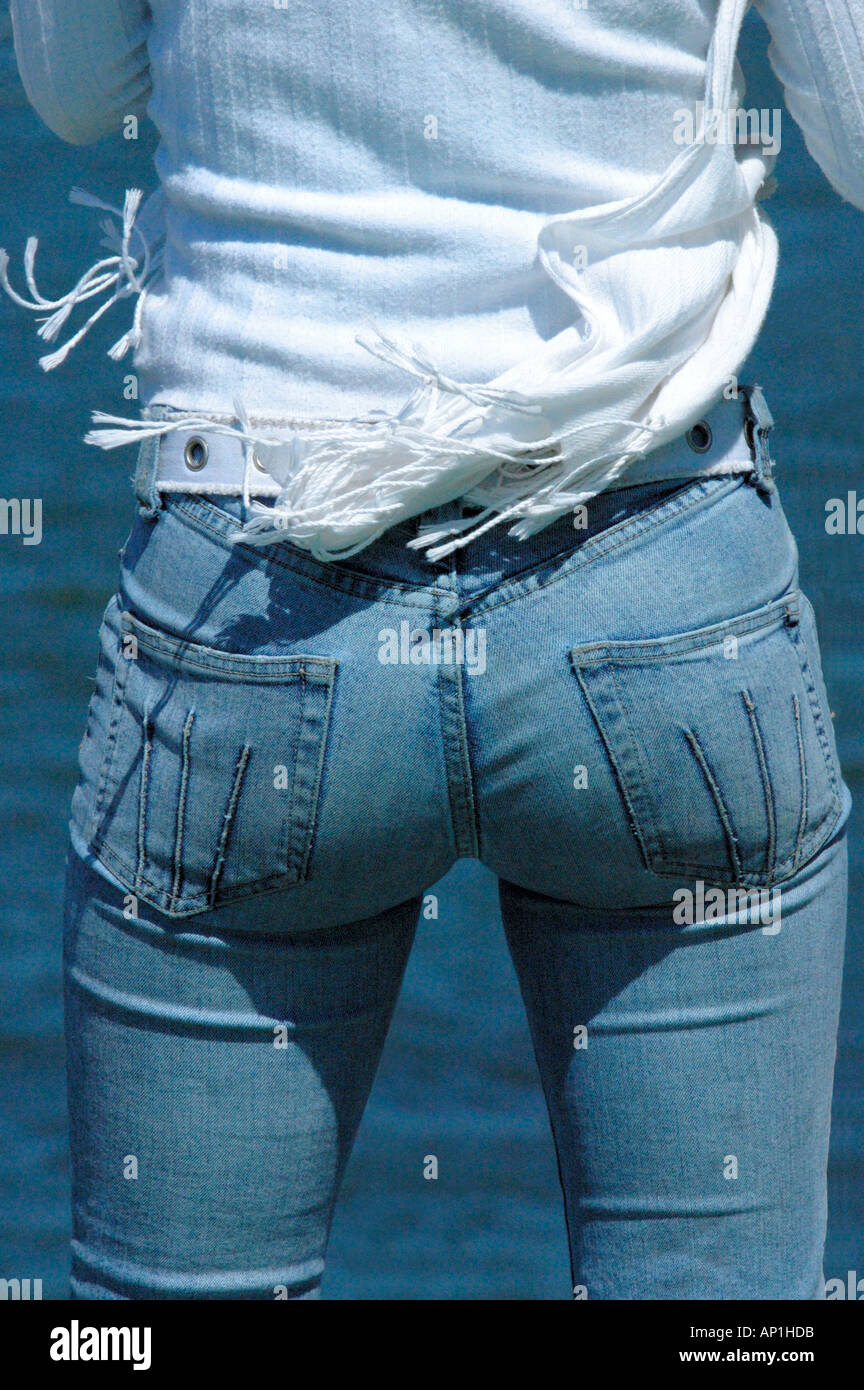 Attractive sexy female bottom in tight blue jeans ocean background Stock  Photo - Alamy