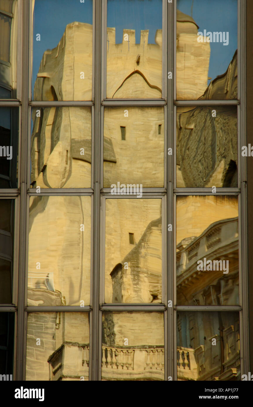 Reflection of Palais des Papes in new glazed facade Avignon France