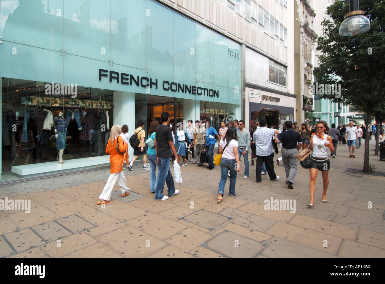 Oxford Street pavement French Connection fcuk store with shoppers Stock Photo