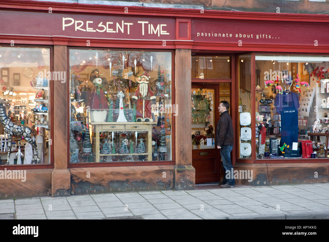 Moffat gift shop front with shopper on the small town of Moffats High