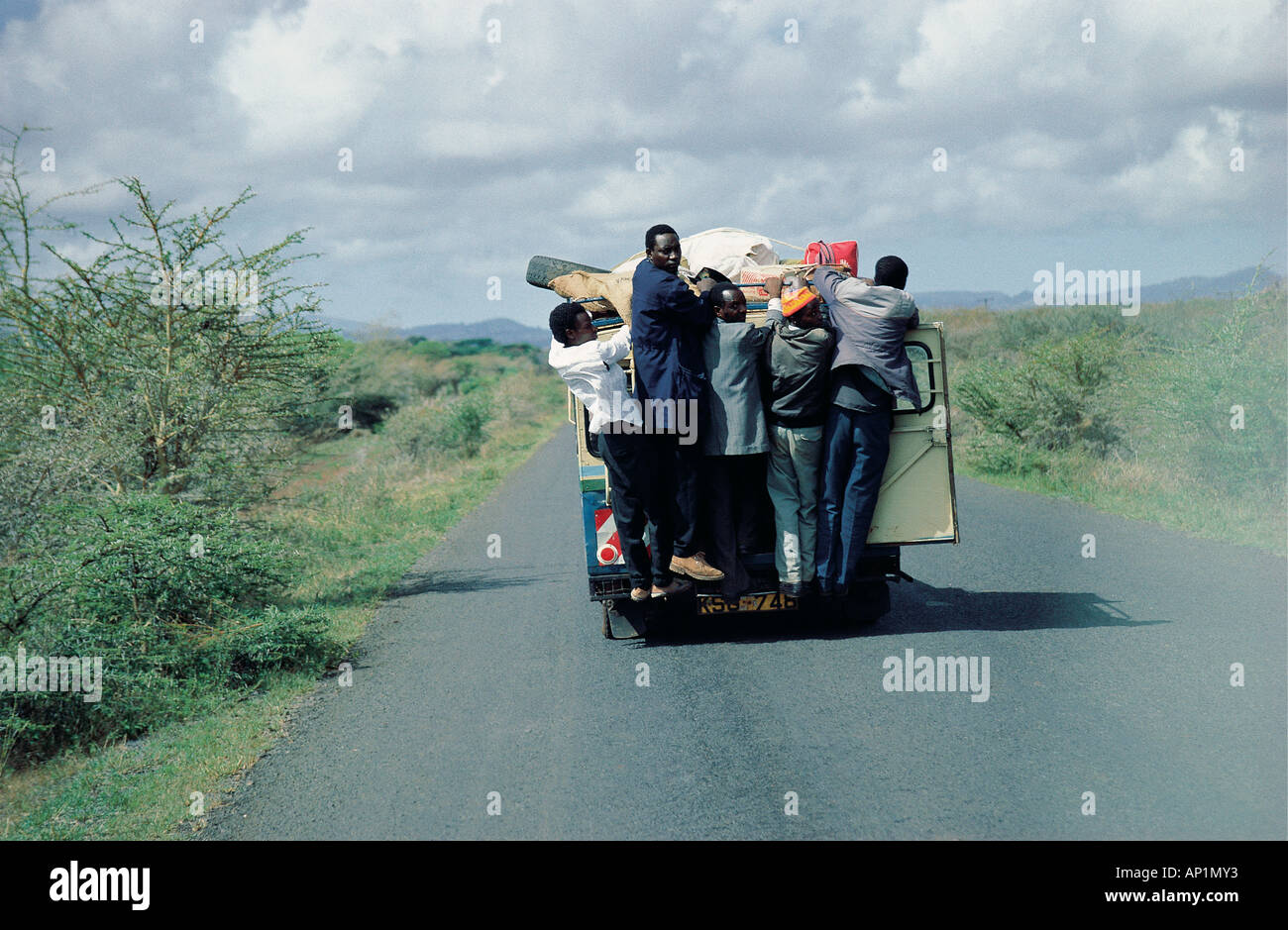 Overloaded local taxi or MATATU on the road from Isiolo to Nanyuki near Mount Kenya Kenya East Africa Stock Photo